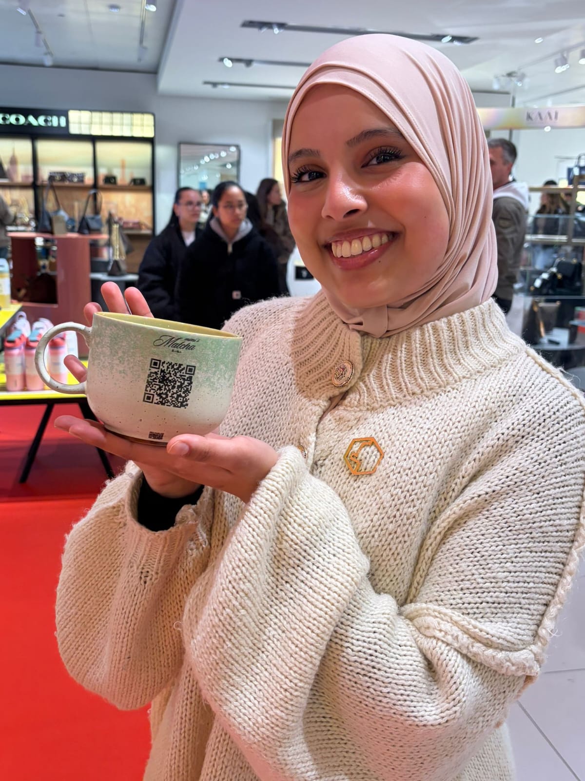 Ceramic mug printed with a Matcha logo and a QR code