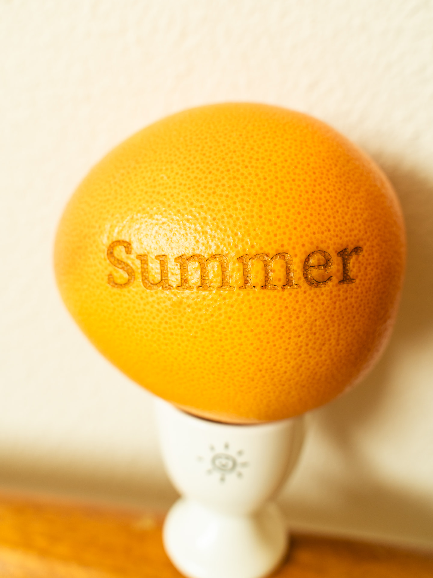 Food-safe laser engraving of the word Summer on a grapefruit