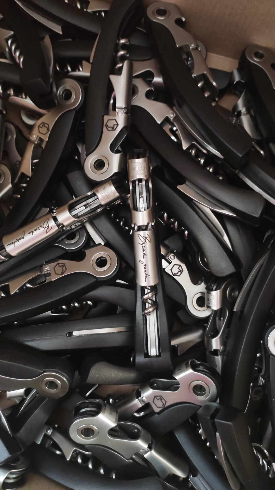 A batch of corkscrews engraved with a signature for a corporate order