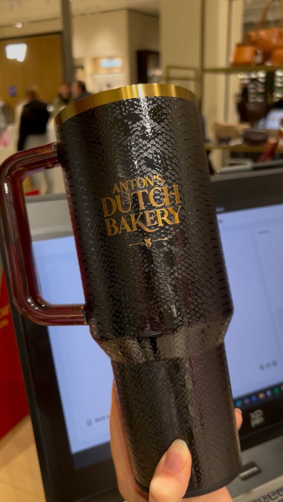 Tumbler with a gold engraved Anton's Dutch Bakery logo