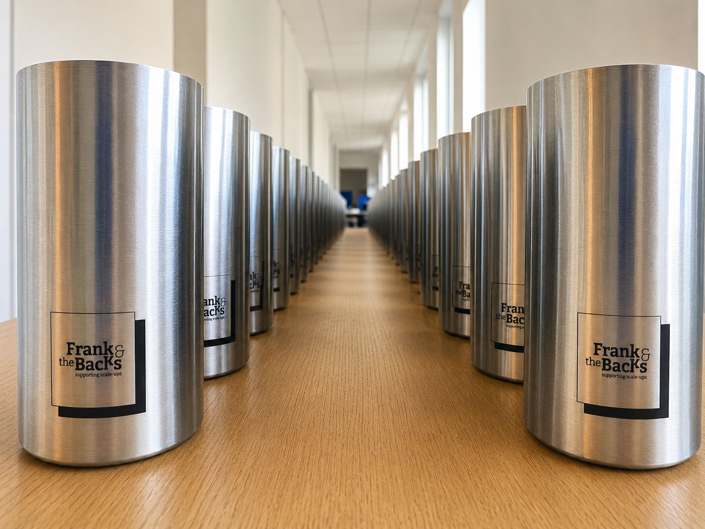Corporate tumblers engraved with the Frank & the Backs logo